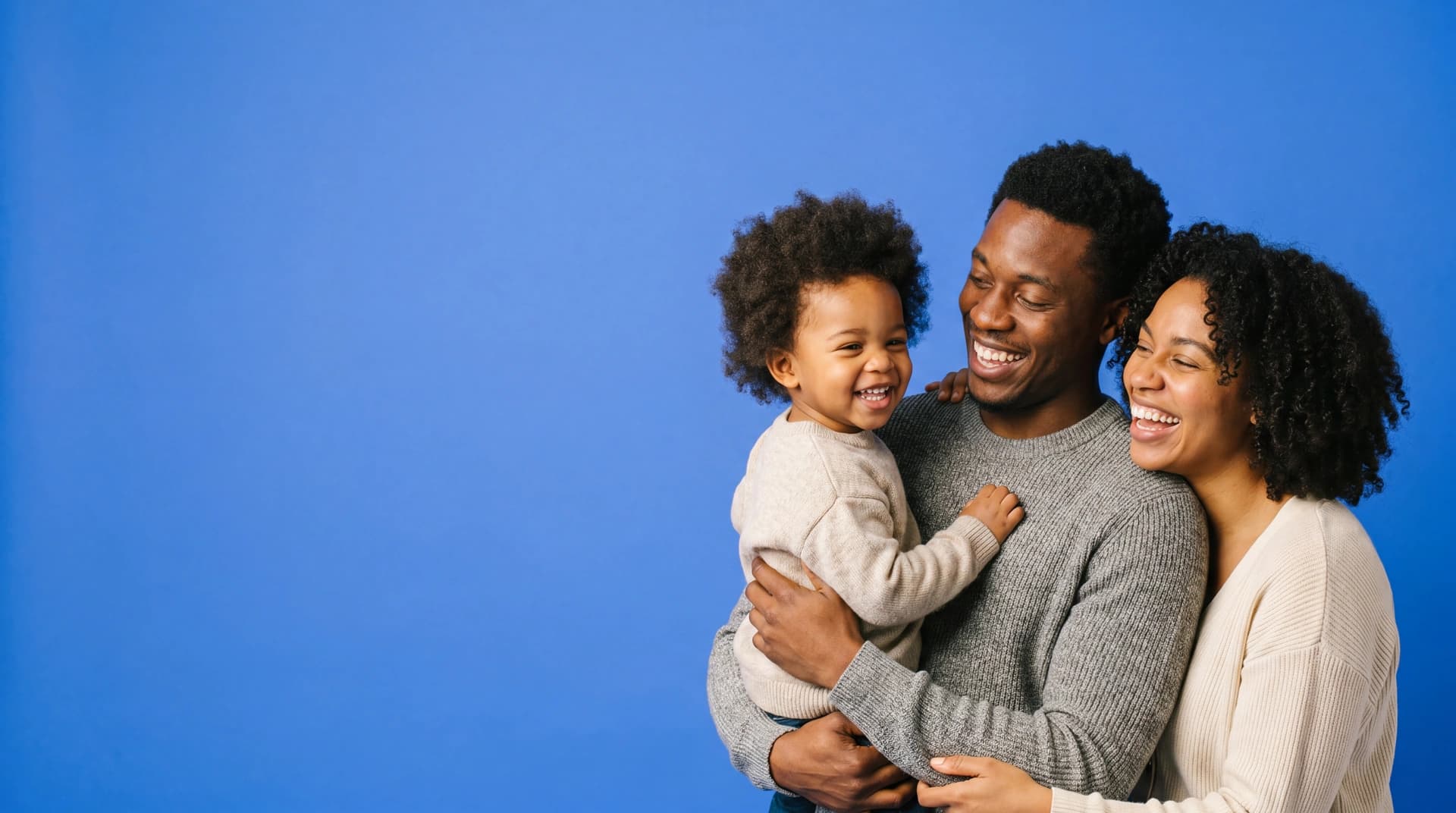 A young Black family sharing a warm, candid moment together — Morningside Medical